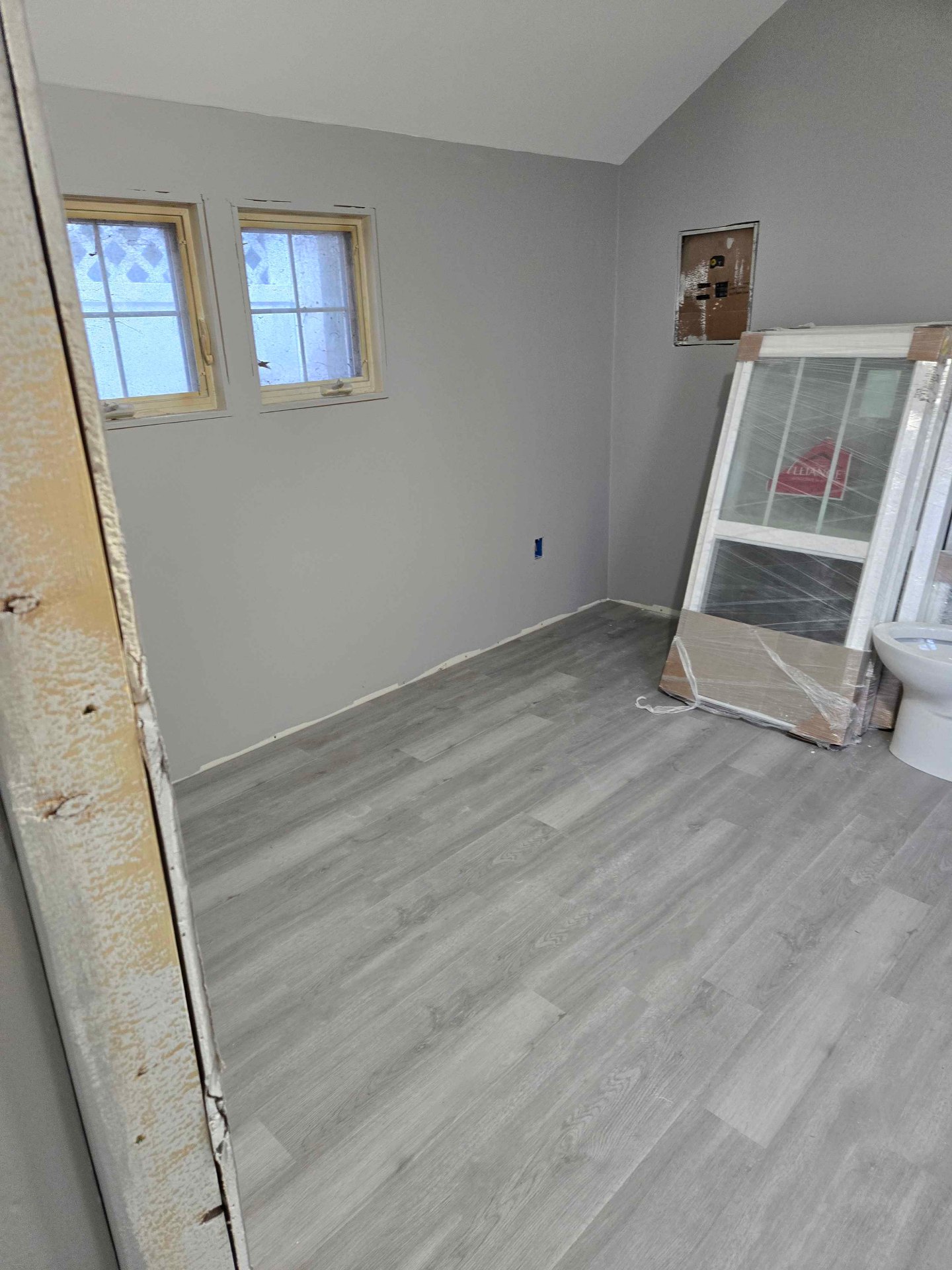 New laminate flooring installed in a remodeled room